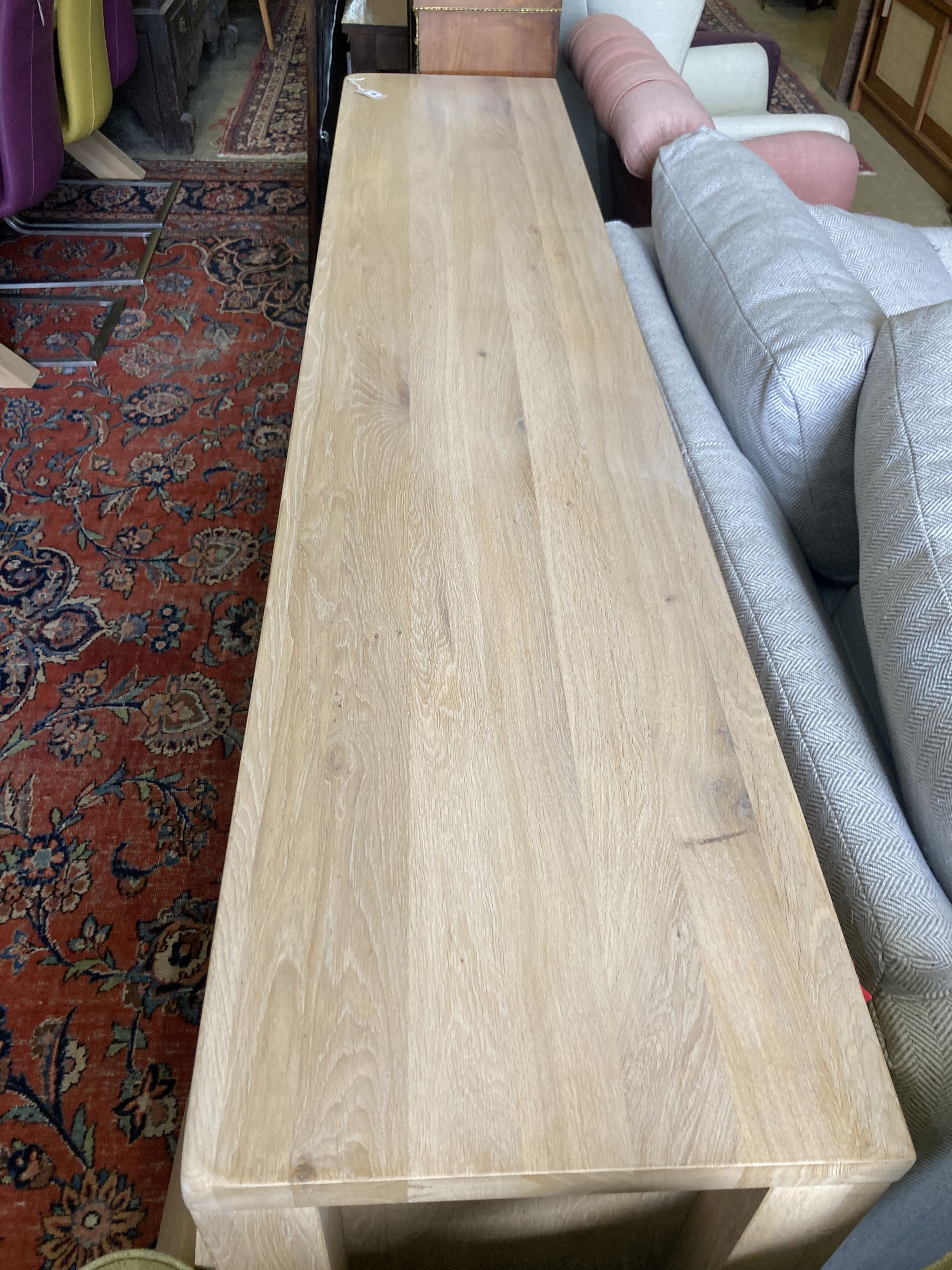 A modern contemporary oak sideboard, length 220cm, depth 45cm, height 85cm